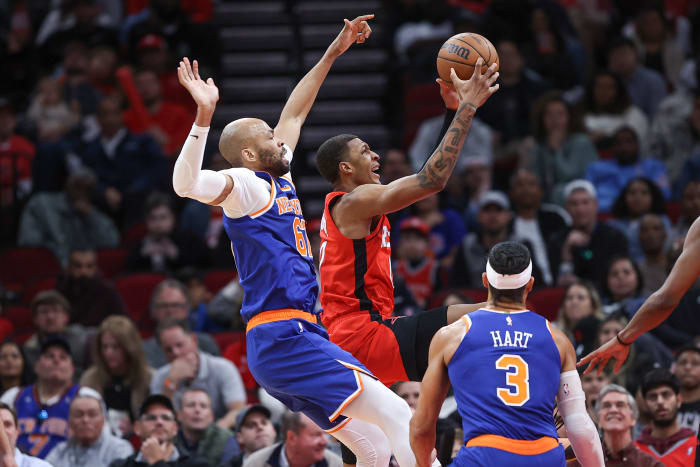 Rockets forward Jabari Smith Jr. (10) grabs a rebound away from New York Knicks forward Taj Gibson (67) during the second quarter at Toyota Center.